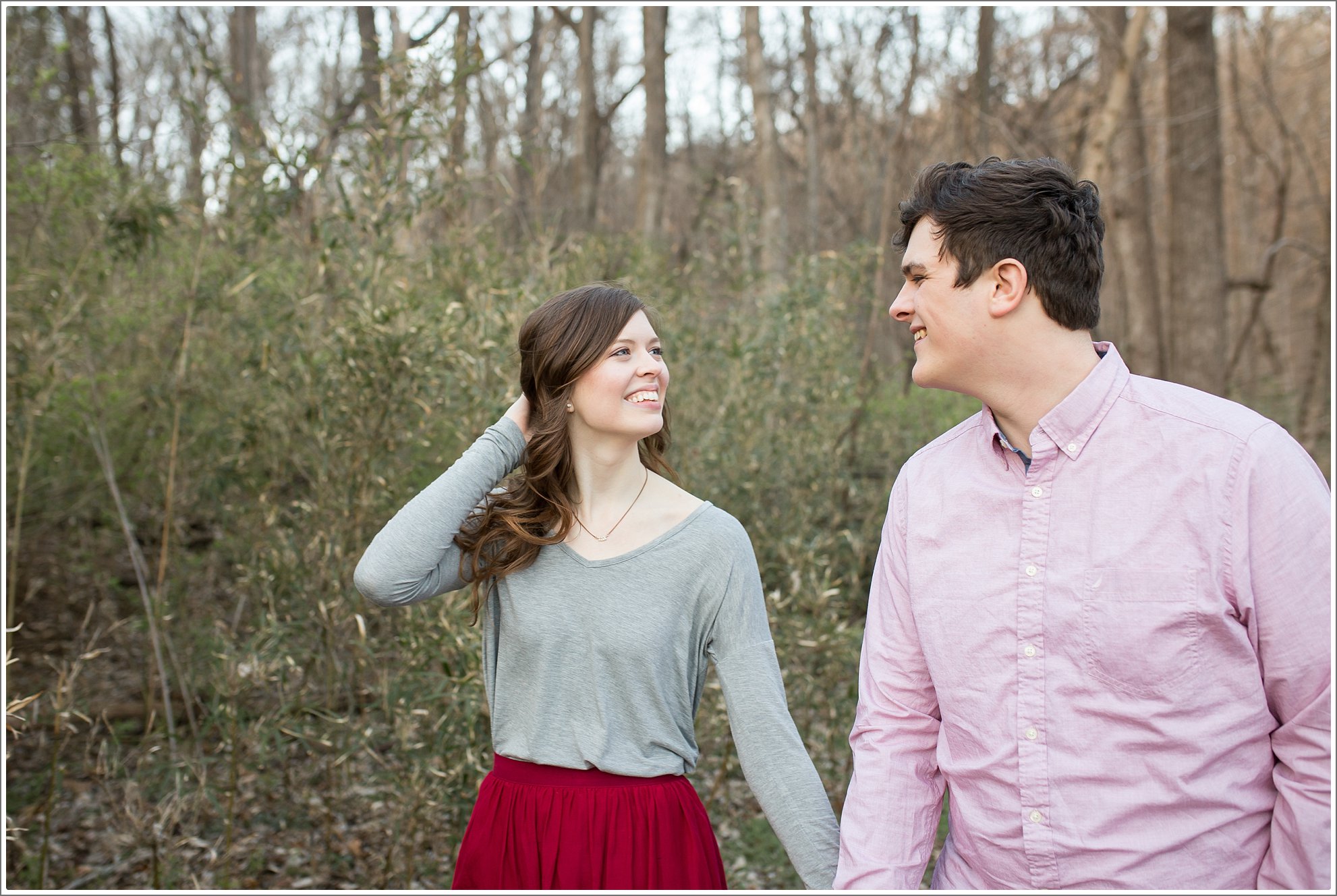 Early Spring Nashville engagement session by the lake at Radnor Lake. Golden sunset and beautiful spring flowering trees were used as the backdrop. 