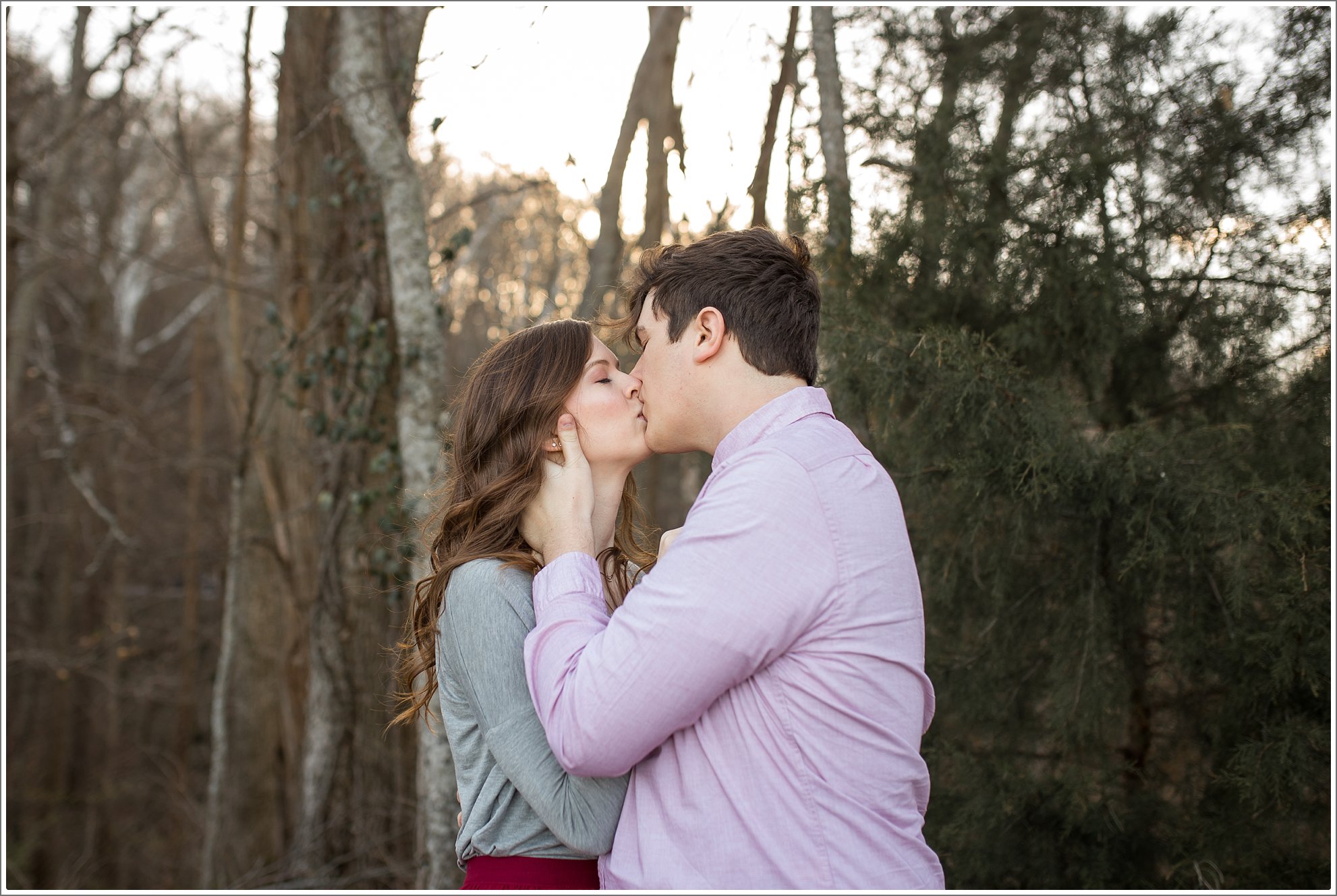 Early Spring Nashville engagement session by the lake at Radnor Lake. Golden sunset and beautiful spring flowering trees were used as the backdrop. 