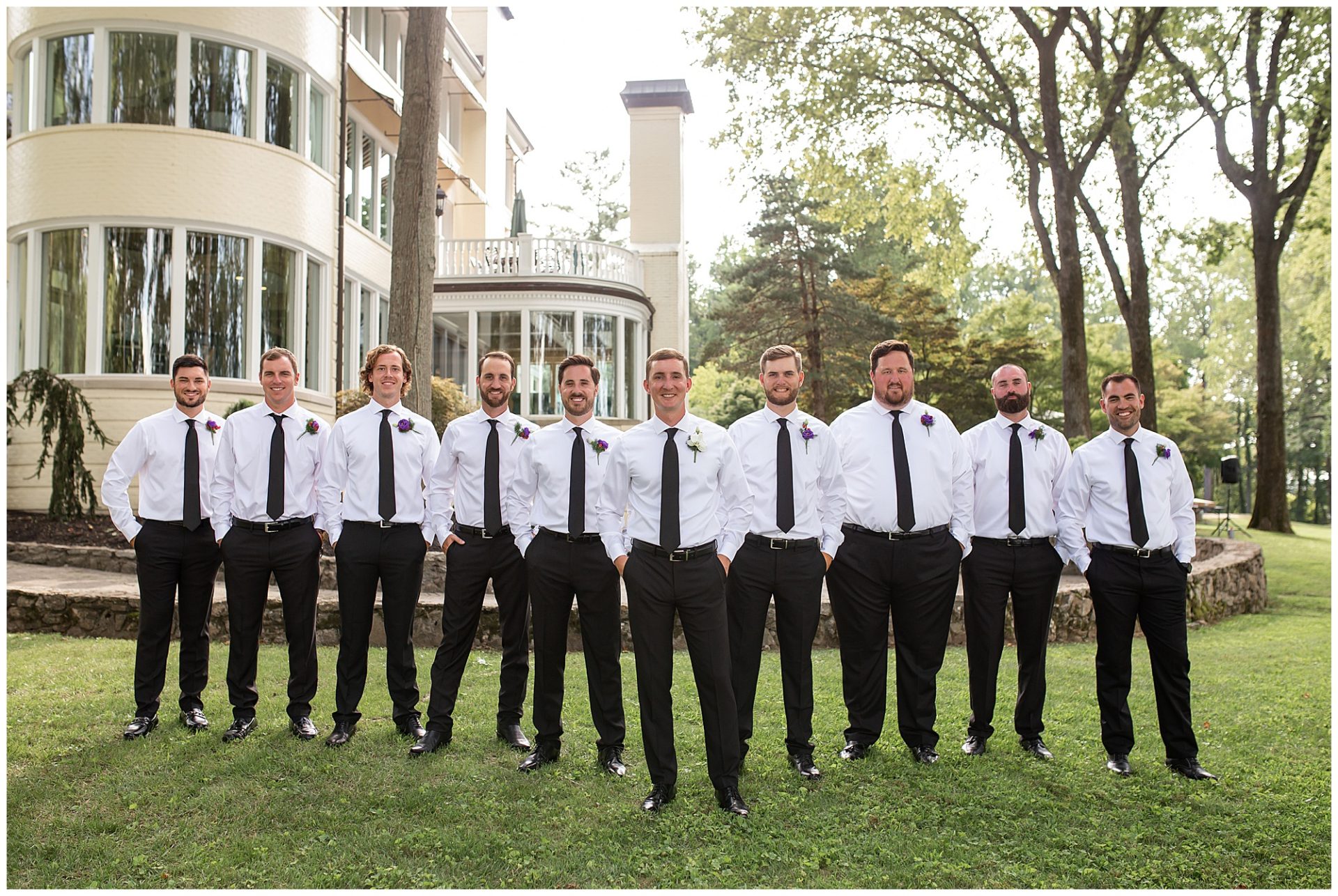 Groomsmen in black suits and at the wedding at The Estate at Cherokee Dock in Nashville